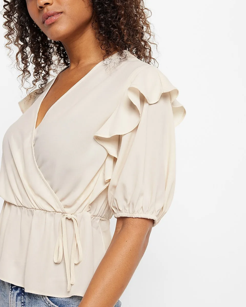Conscious Edit Faux Wrap Puff Sleeve Peplum Top in Sandshell