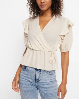 Conscious Edit Faux Wrap Puff Sleeve Peplum Top in Sandshell